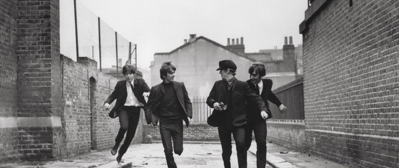 A black and white photo of the Beatles