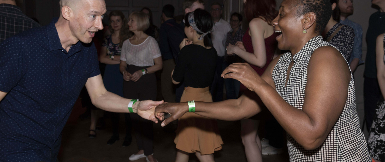 A photo of Bishopsgate Swing participants in motion.