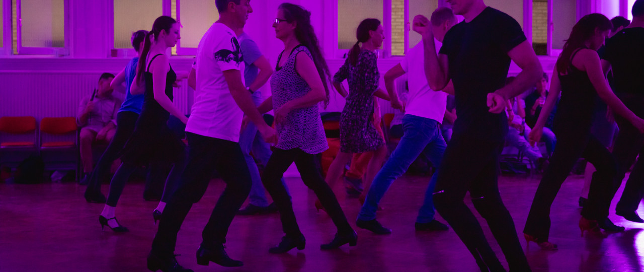 A photo of people dancing at a Pink Jukebox event.