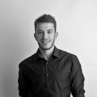 A black and white portrait photo of tutor Clement Guerra.